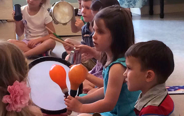 Children playing percussion instruments.