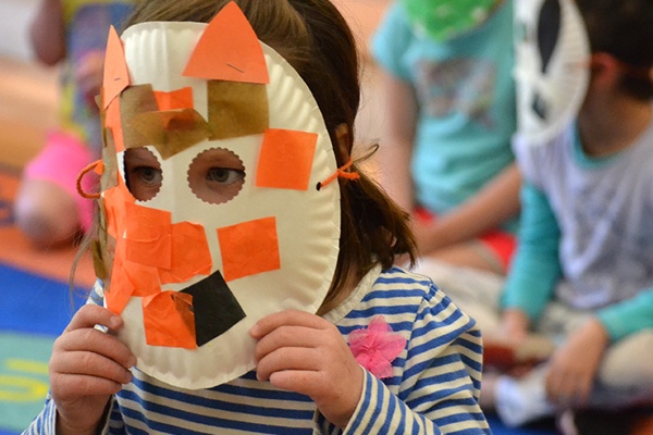 Young child wearing a mask.