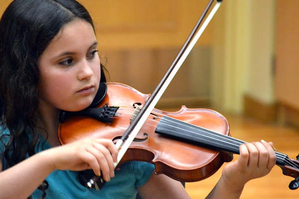 student playing a fiddle.