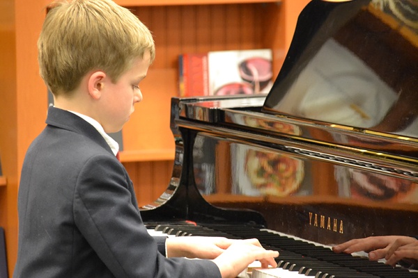 SSC piano student performing in a recital.