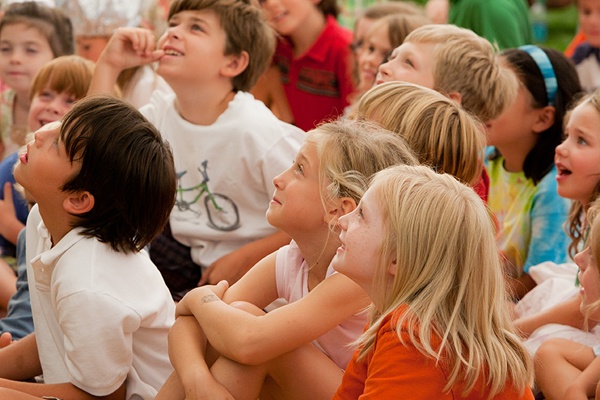 Children watching a performance