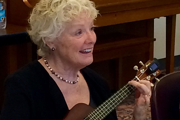 Woman playing a ukulele