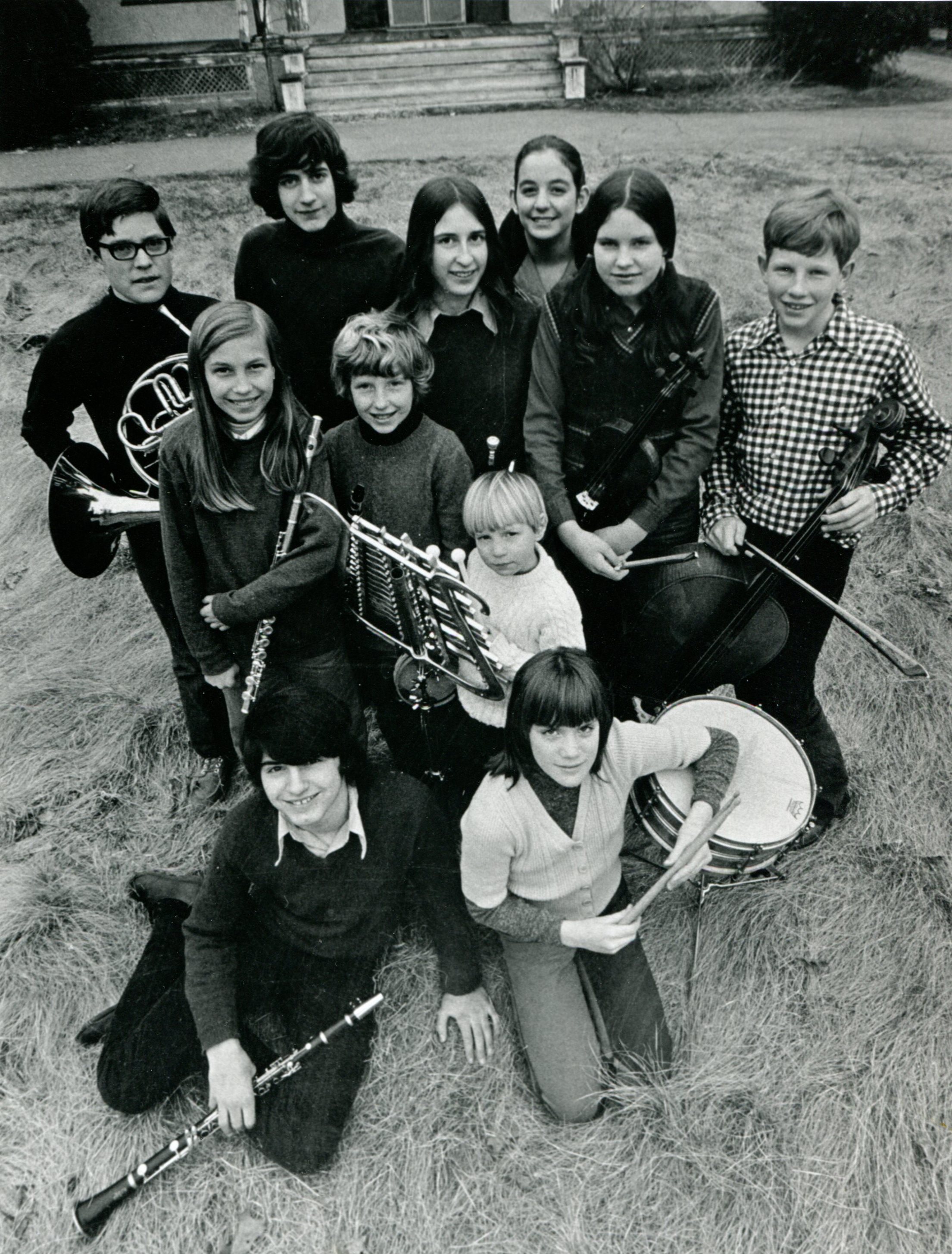 Vintage SSC photo of students holding various instruments