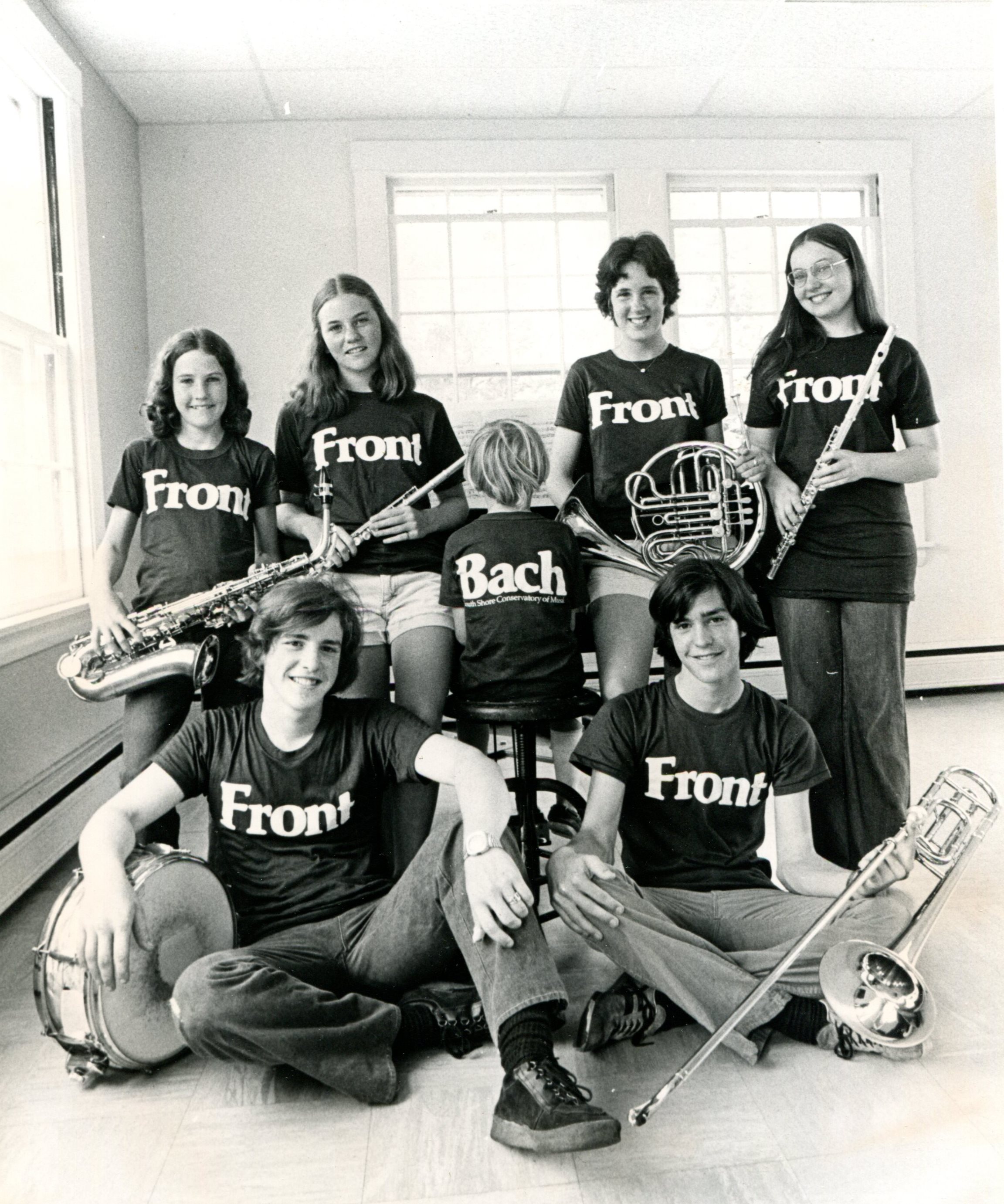 Vintage SSC photo with students wearing shirts that say Front and Bach.