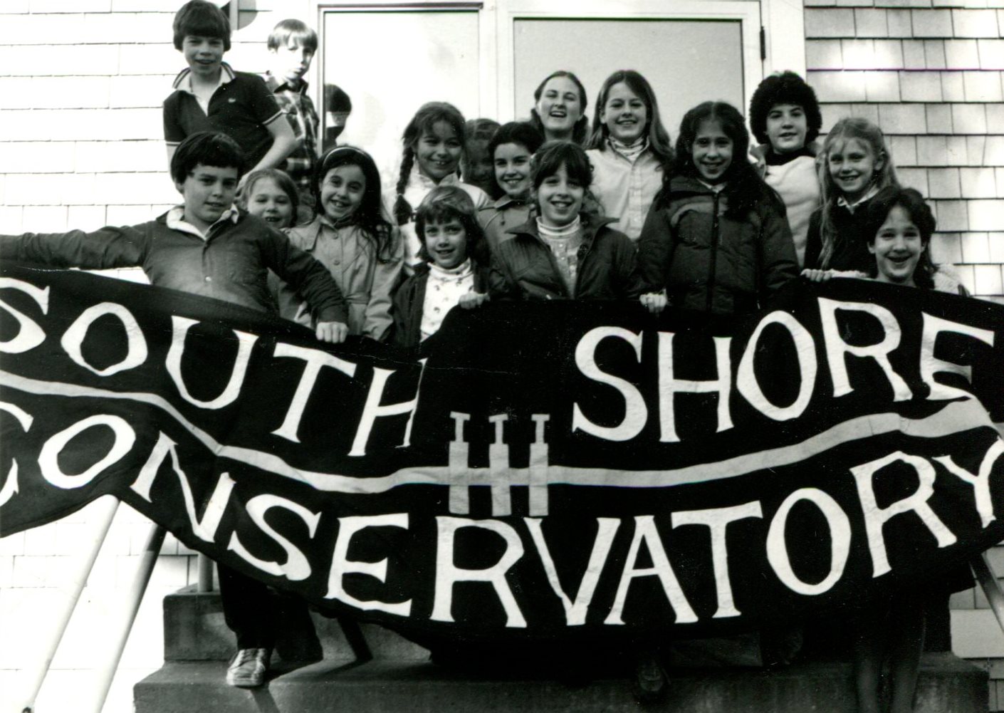 Vintage SSC photo of students holding a big SSC banner.